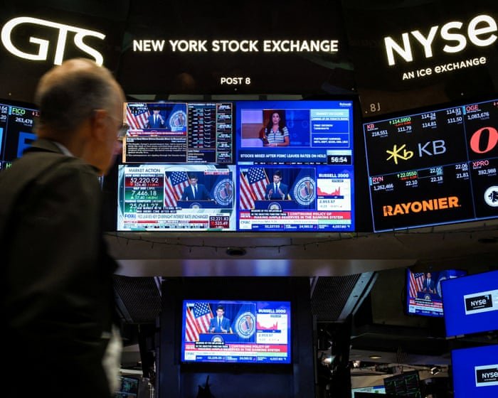 A lone bull in a tuxedo popping champagne on top of a giant green stock chart while the ground below is gray and empty.